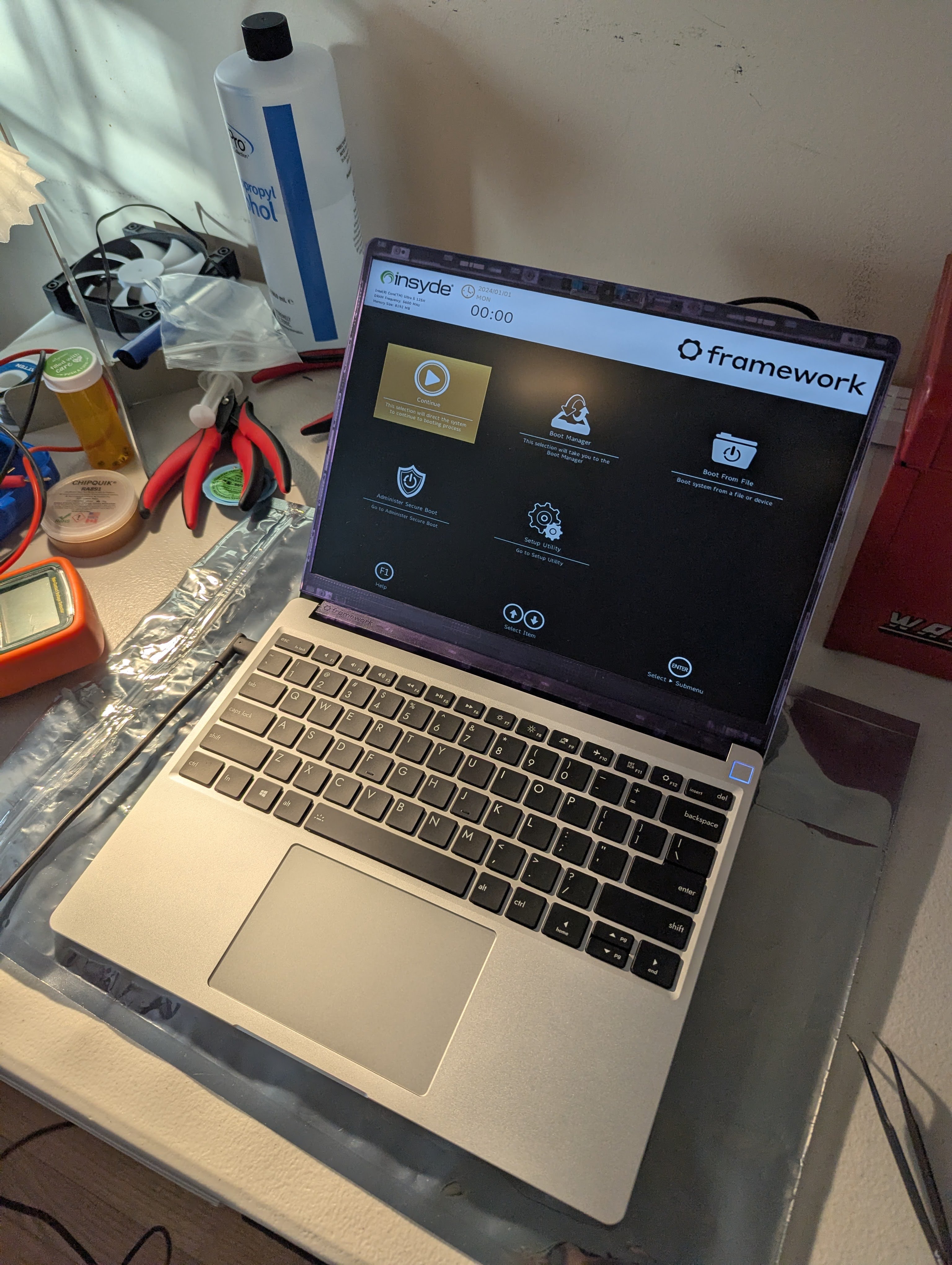 An assembled laptop with the screen on and the bios screen showing on the display